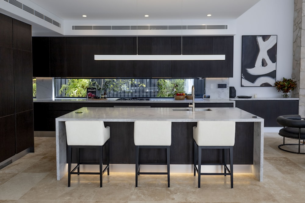 a kitchen with black cabinets