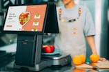 a chef standing next to a counter