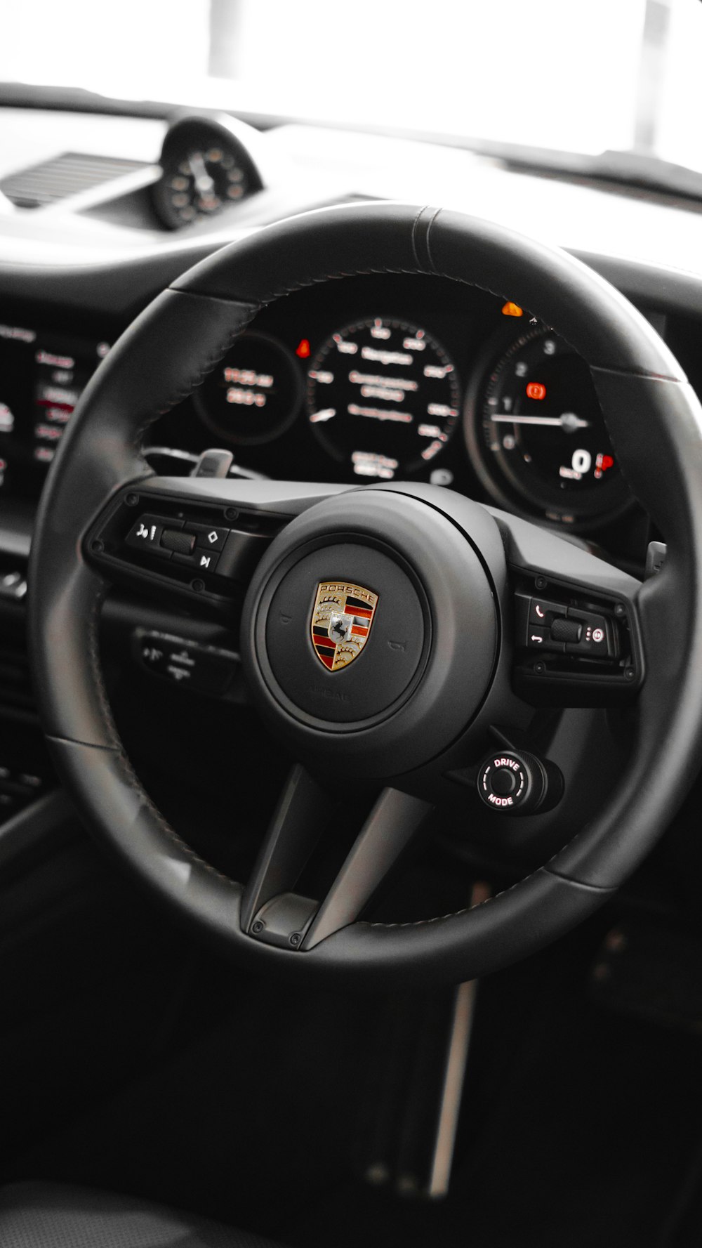 the steering wheel and dashboard of a car