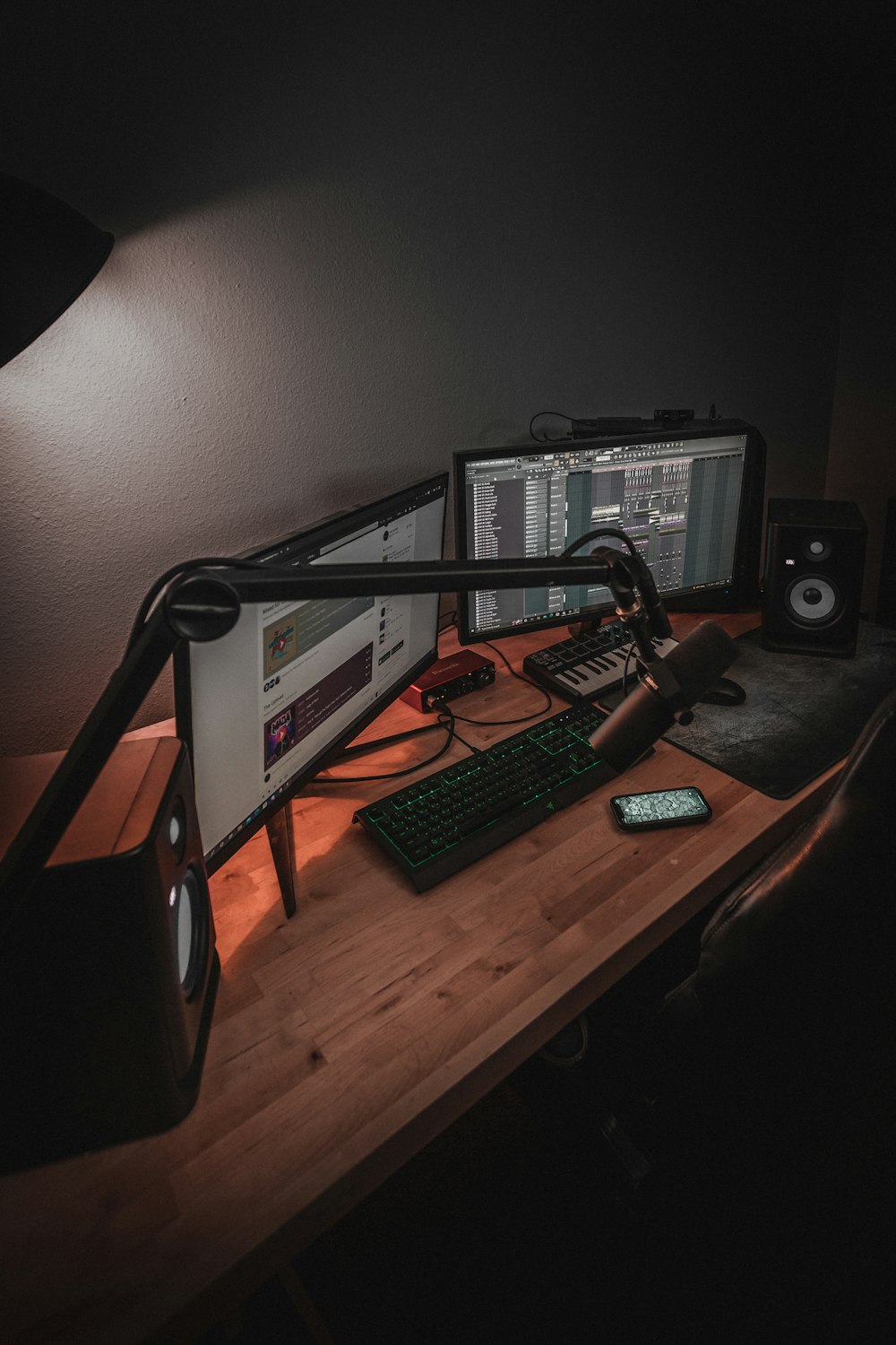 a desk with a computer and other electronics on it