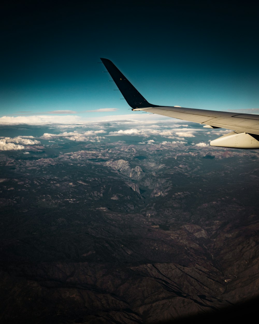 an airplane wing in the sky