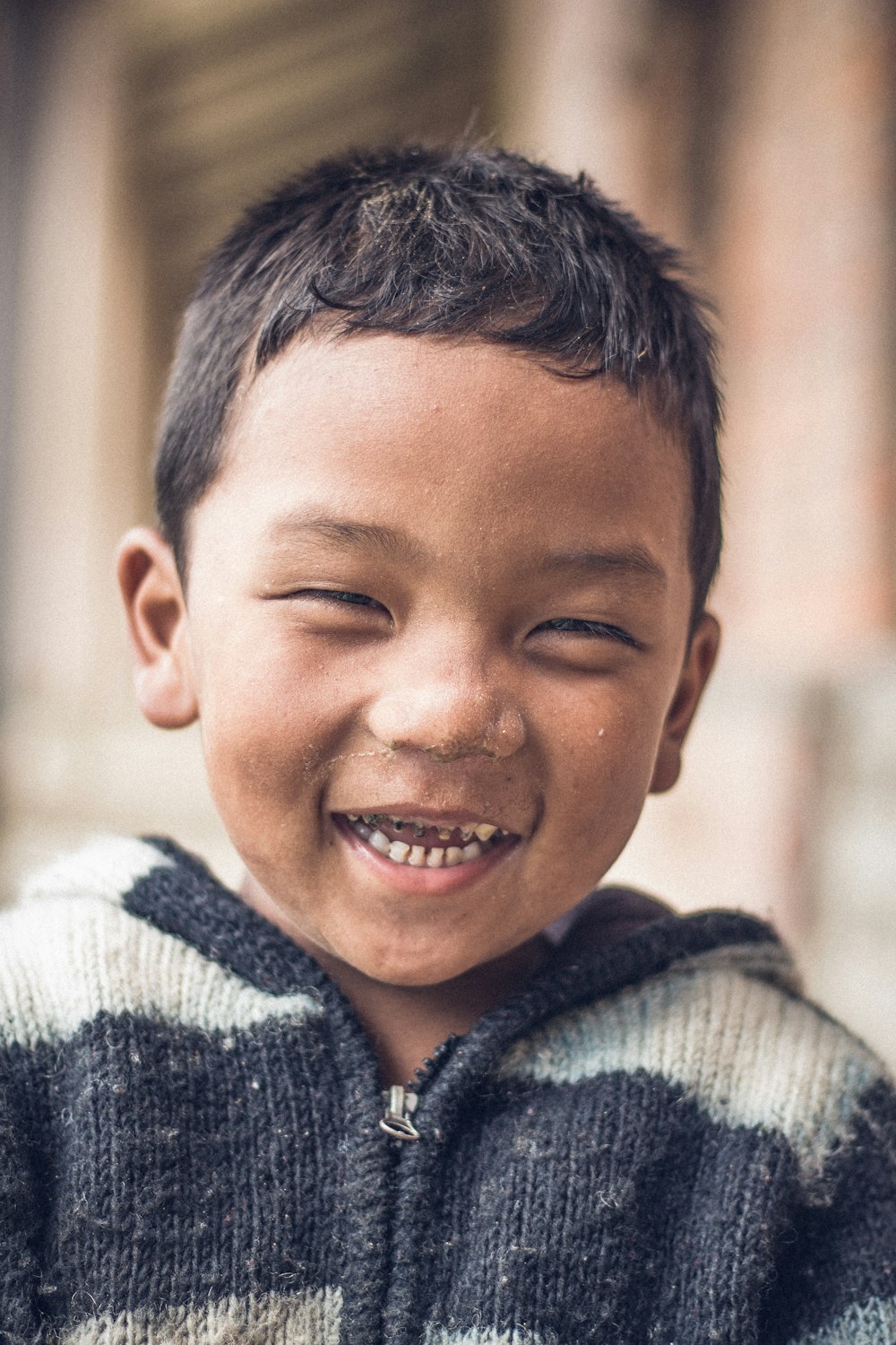 a boy smiling for the camera