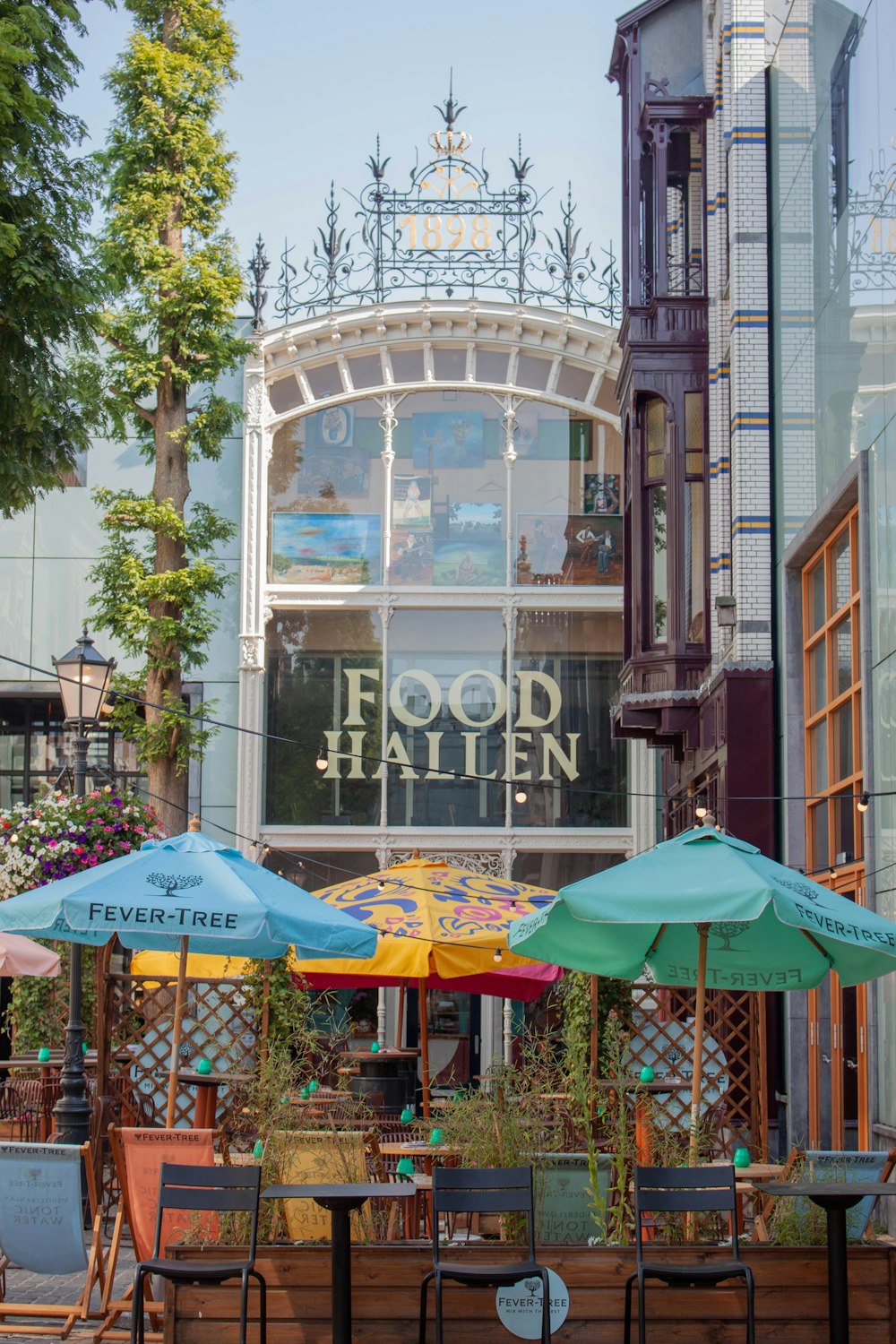 a group of tables and chairs outside of a building