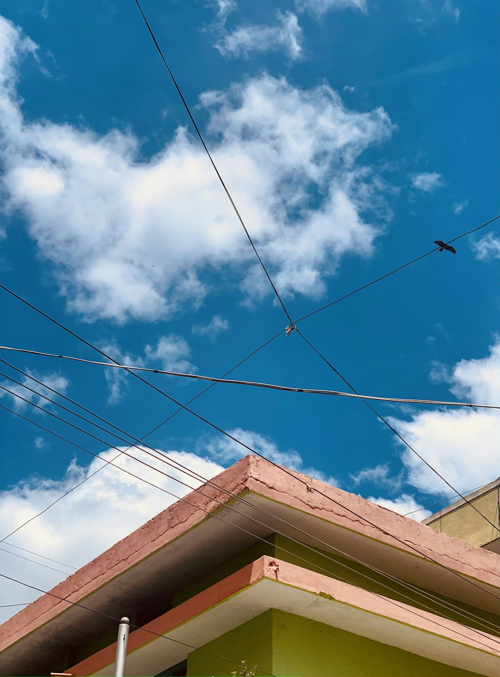 a roof with power lines above it