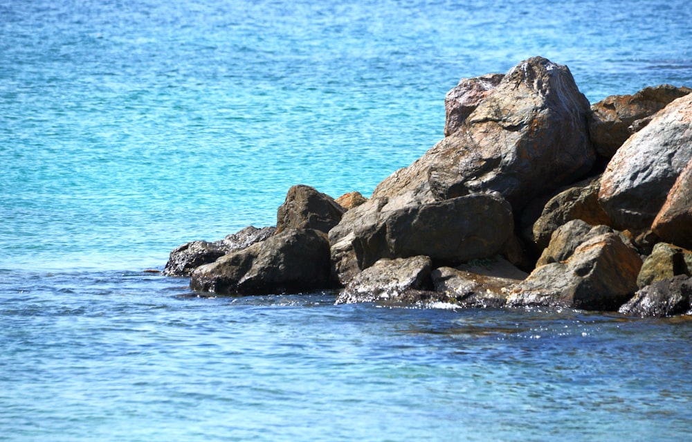 a group of rocks in the water