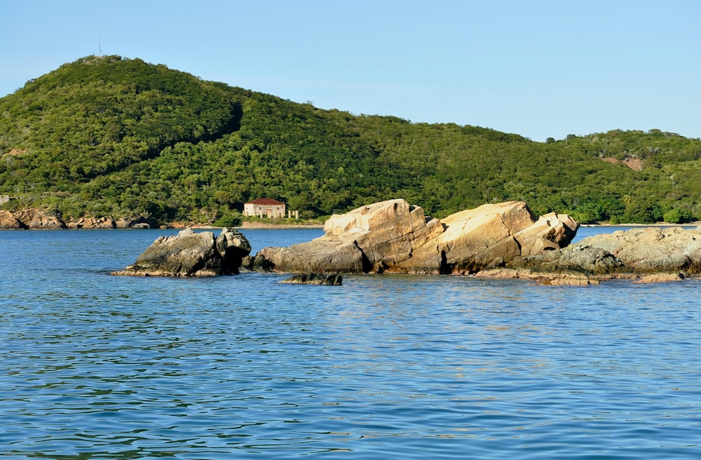 a small house on a rocky island