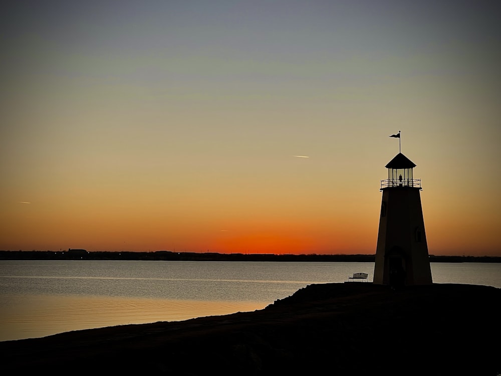 a lighthouse on a rocky shore