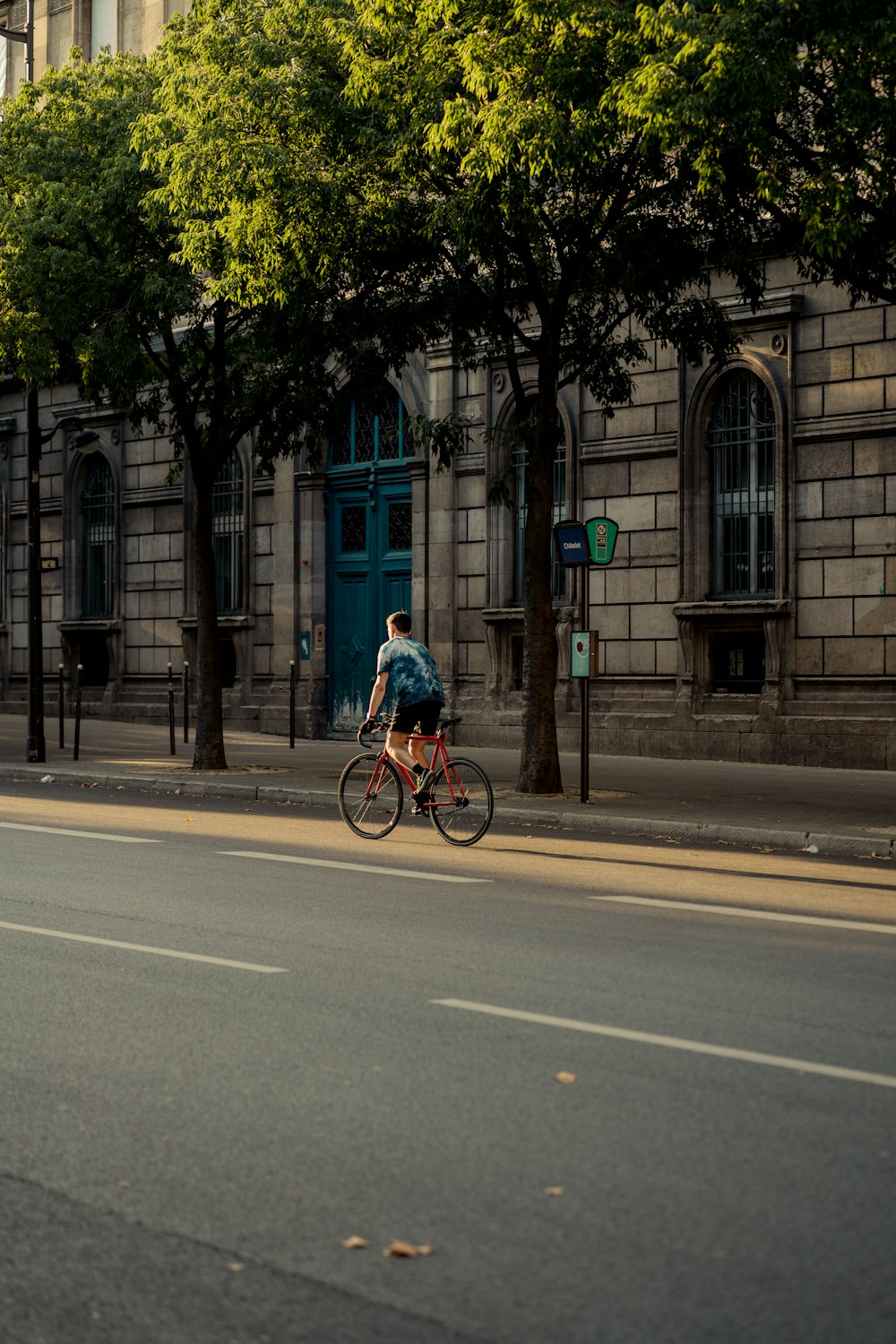 a person riding a bicycle on a street