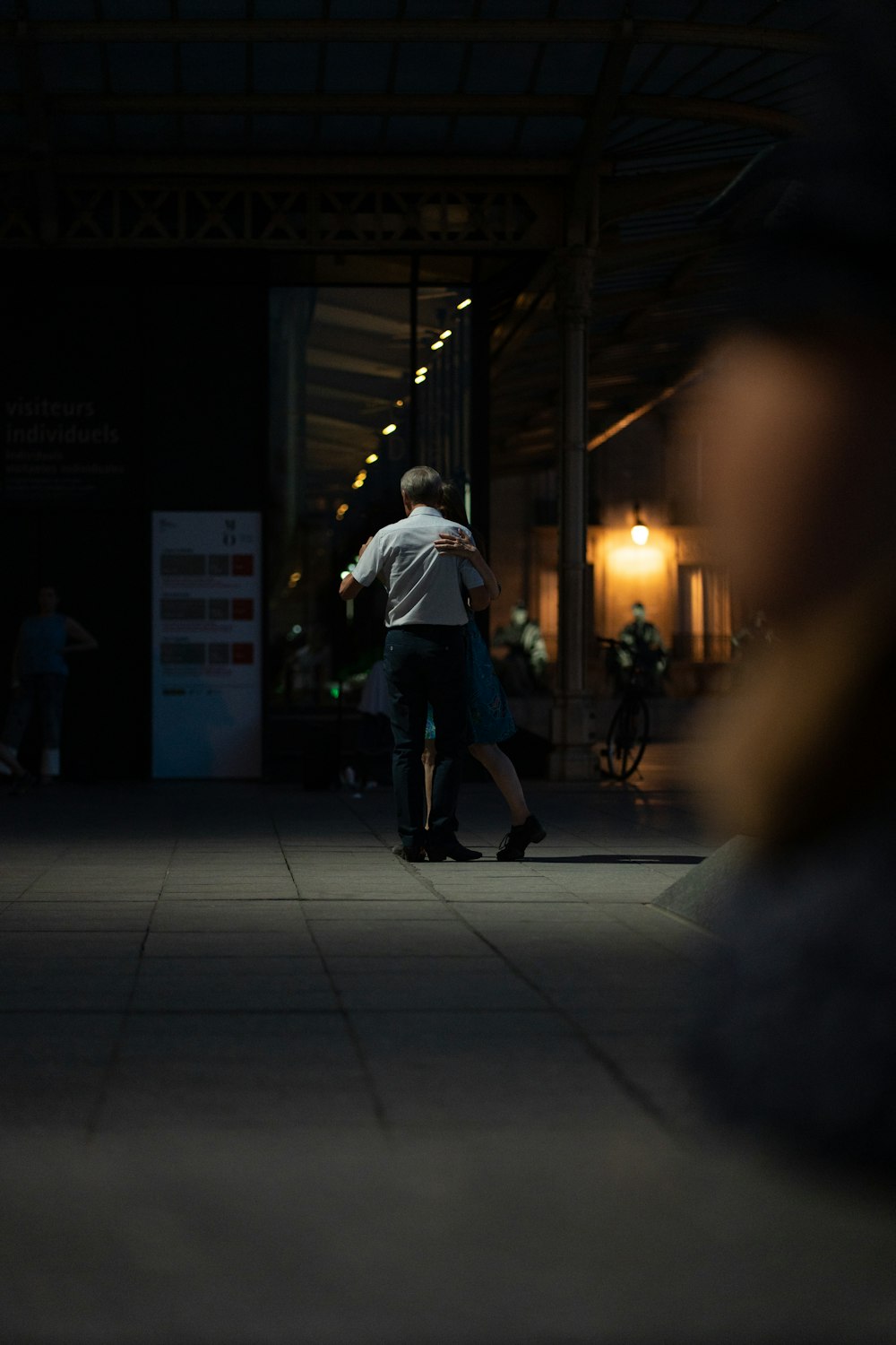 a man walking in a dark alley