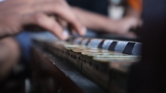 a close-up of hands playing a piano