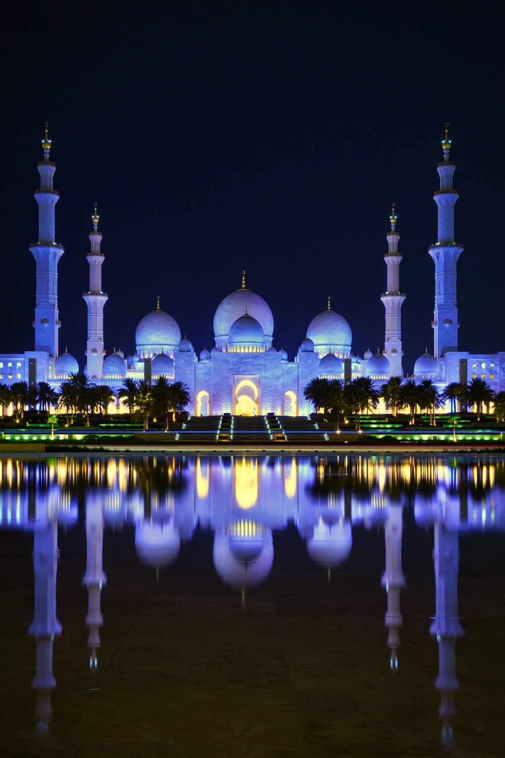 a building with towers and domes at night