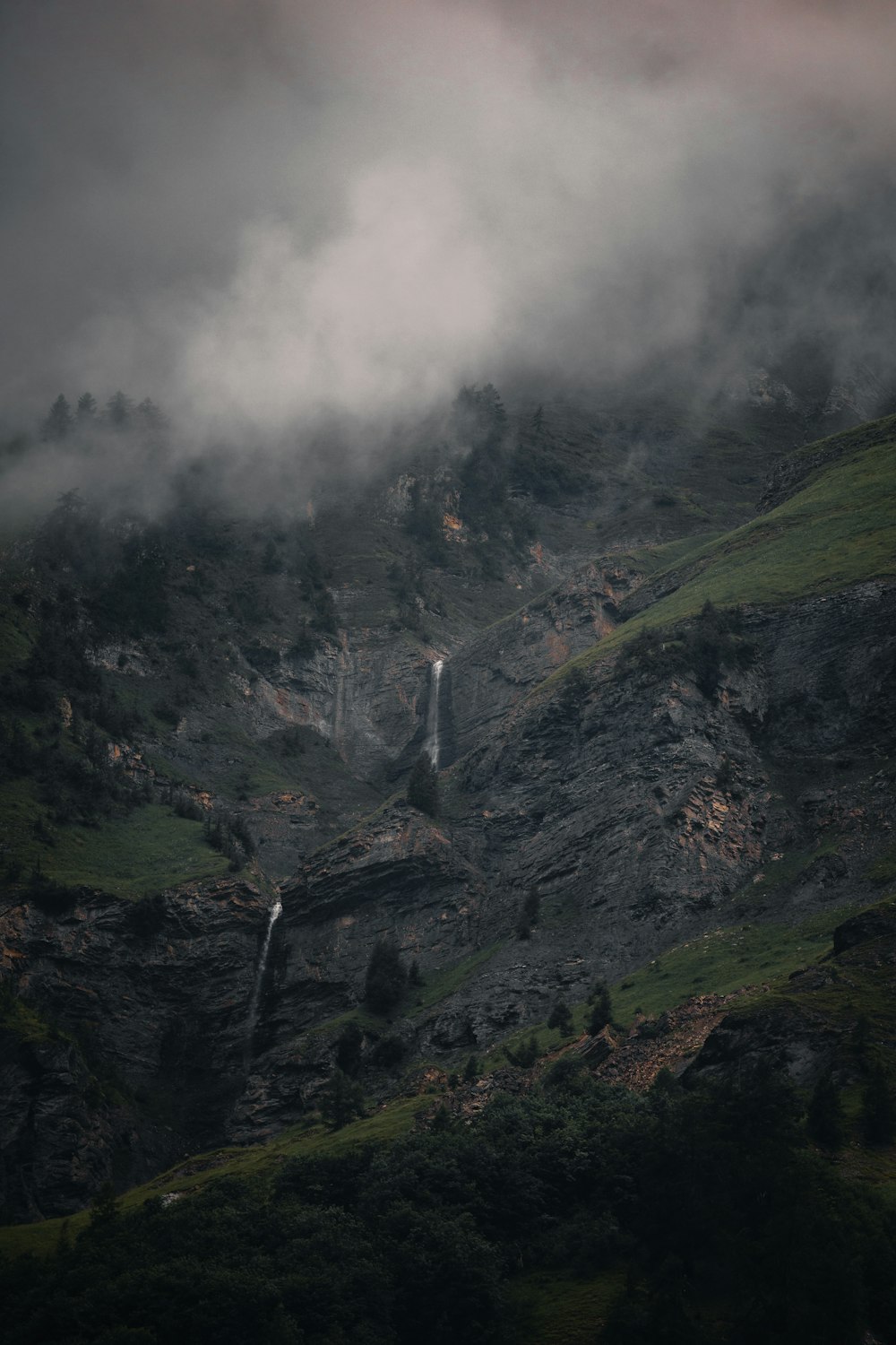 a waterfall in a valley