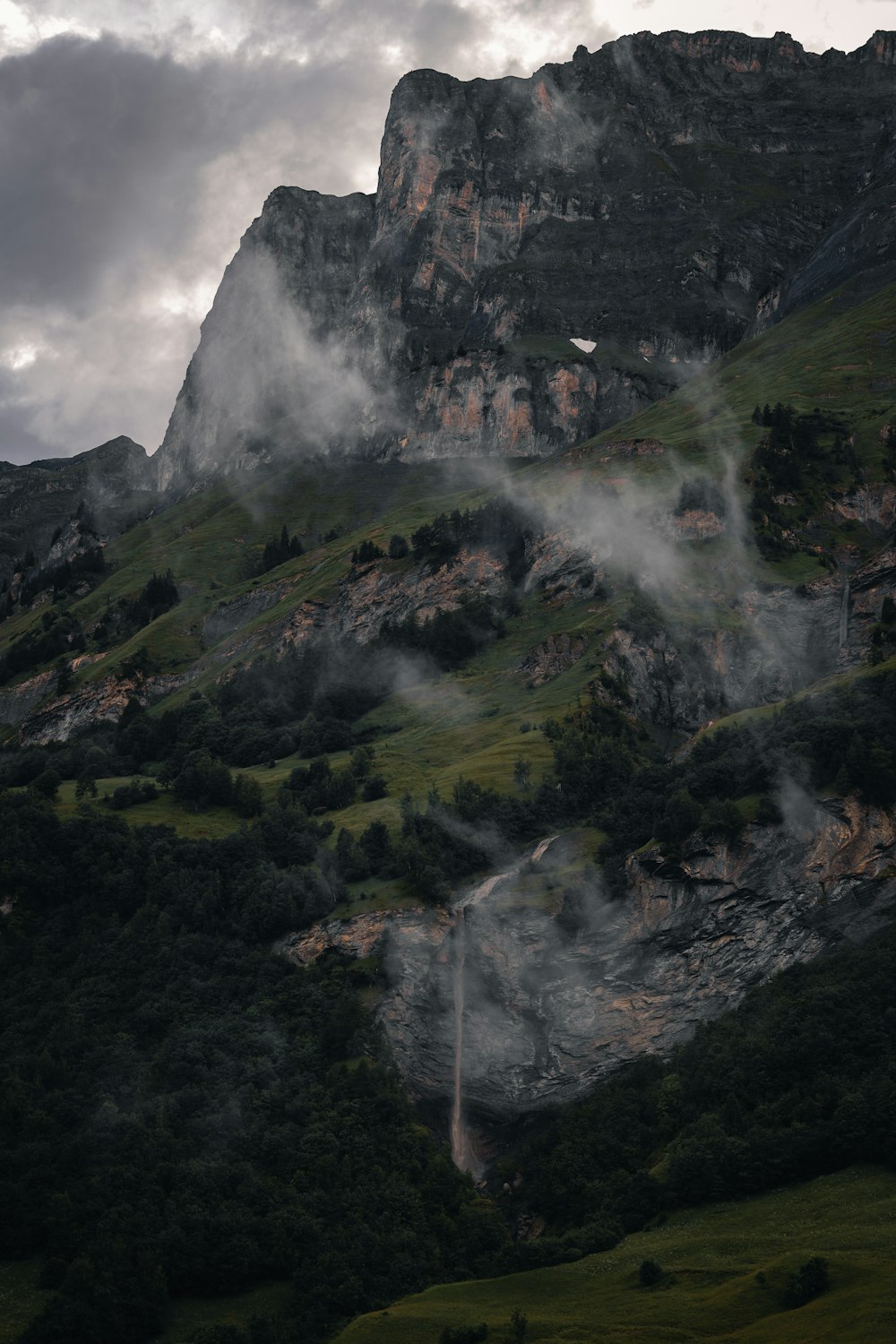 a waterfall in a valley