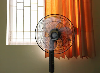 a fan in front of a window