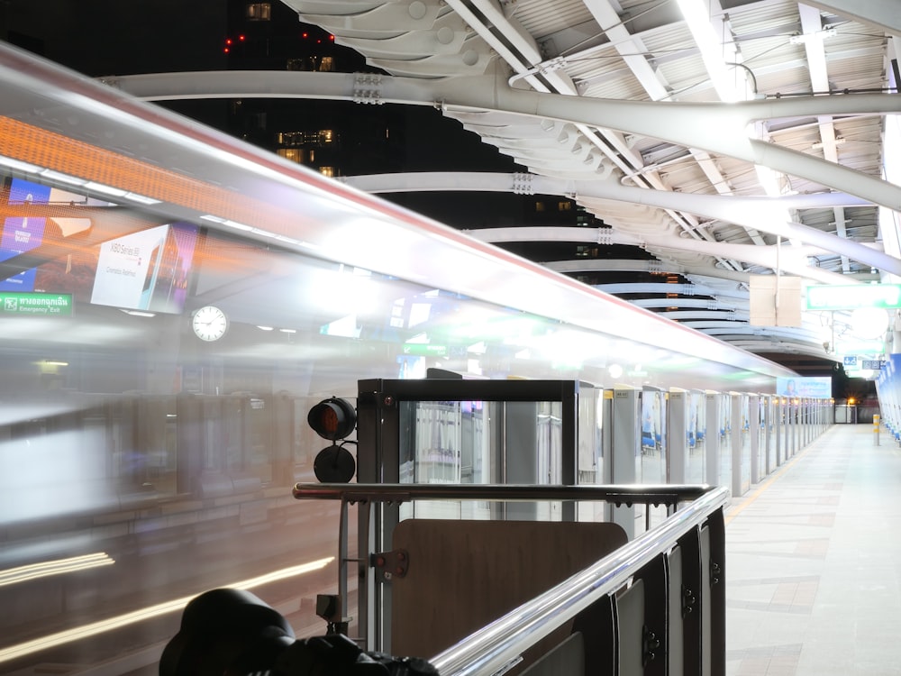 a train station with a railing