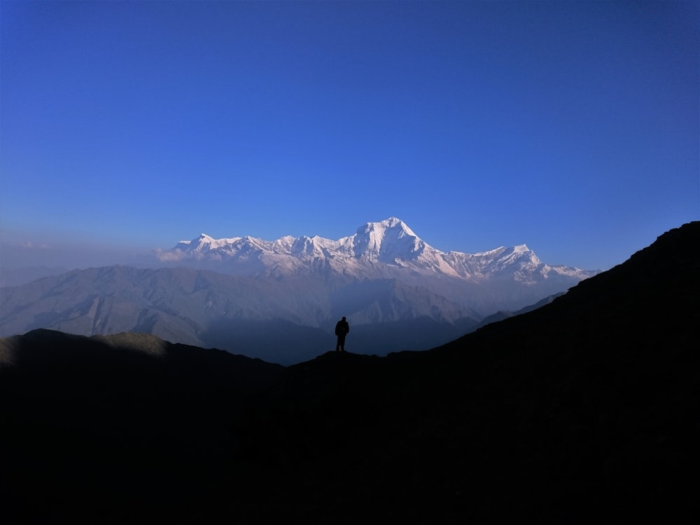 a person standing on a mountain