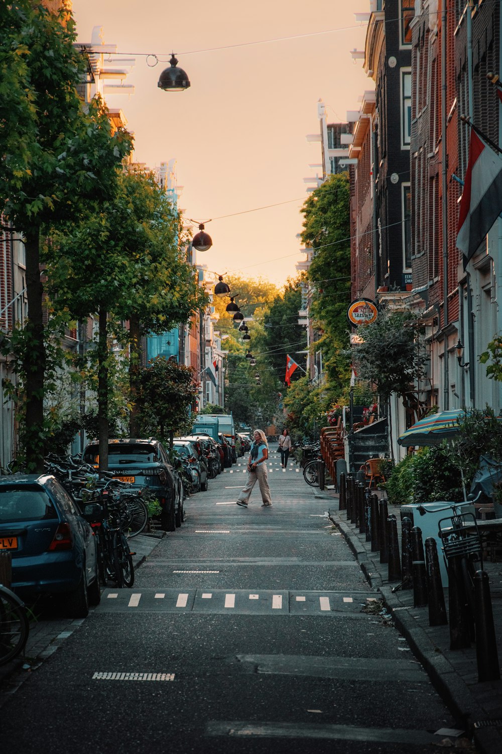 a street with cars and people