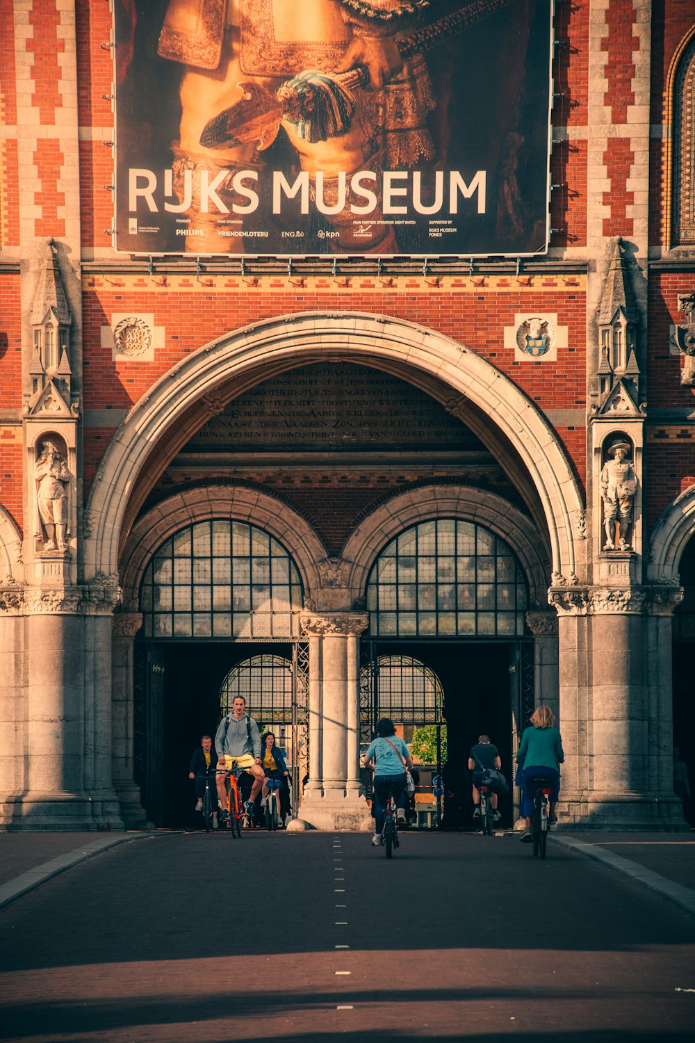 a group of people walking through a building