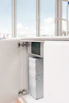 A cozy home kitchen with several garrafones of fresh water ready for use
