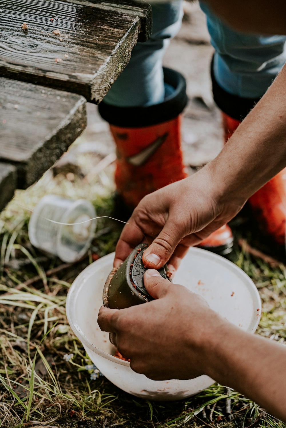 a person cutting food on a plate