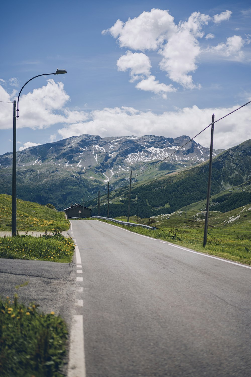 a road with mountains in the background