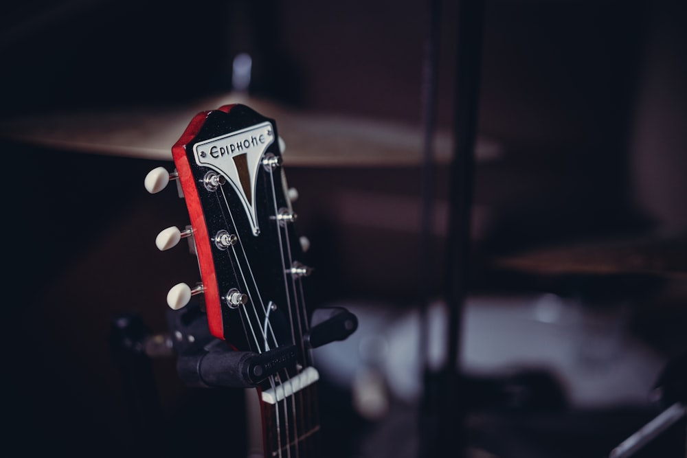 a guitar leaning against a wall