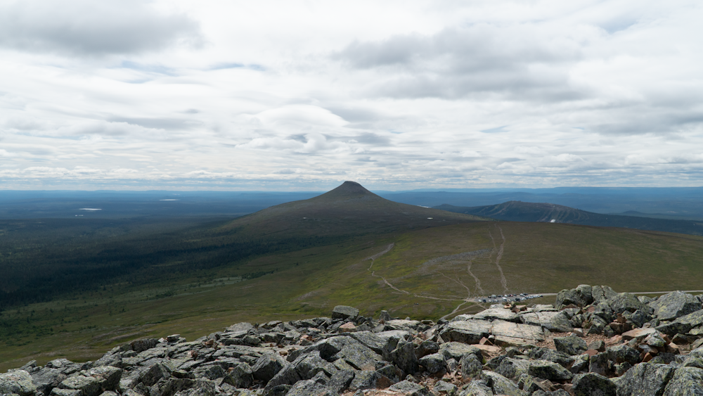 a rocky landscape with hills in the background