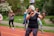 A group of men over 50 exercising together outdoors, showcasing camaraderie and motivation.