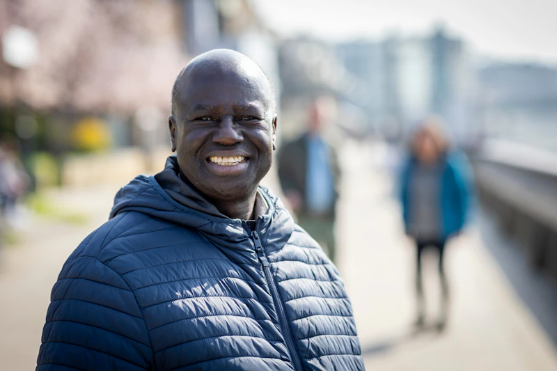Happy mature Black African man smiling outdoors – men's health