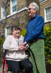 a man and a woman standing outside