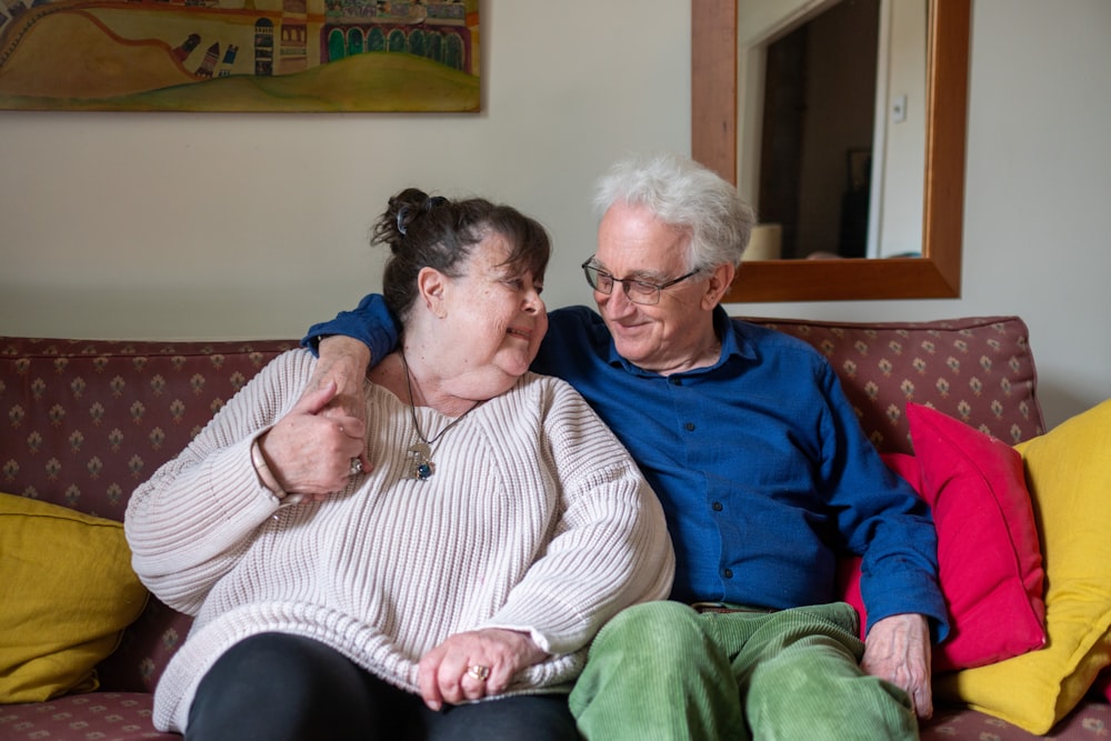 a man and woman sitting on a couch