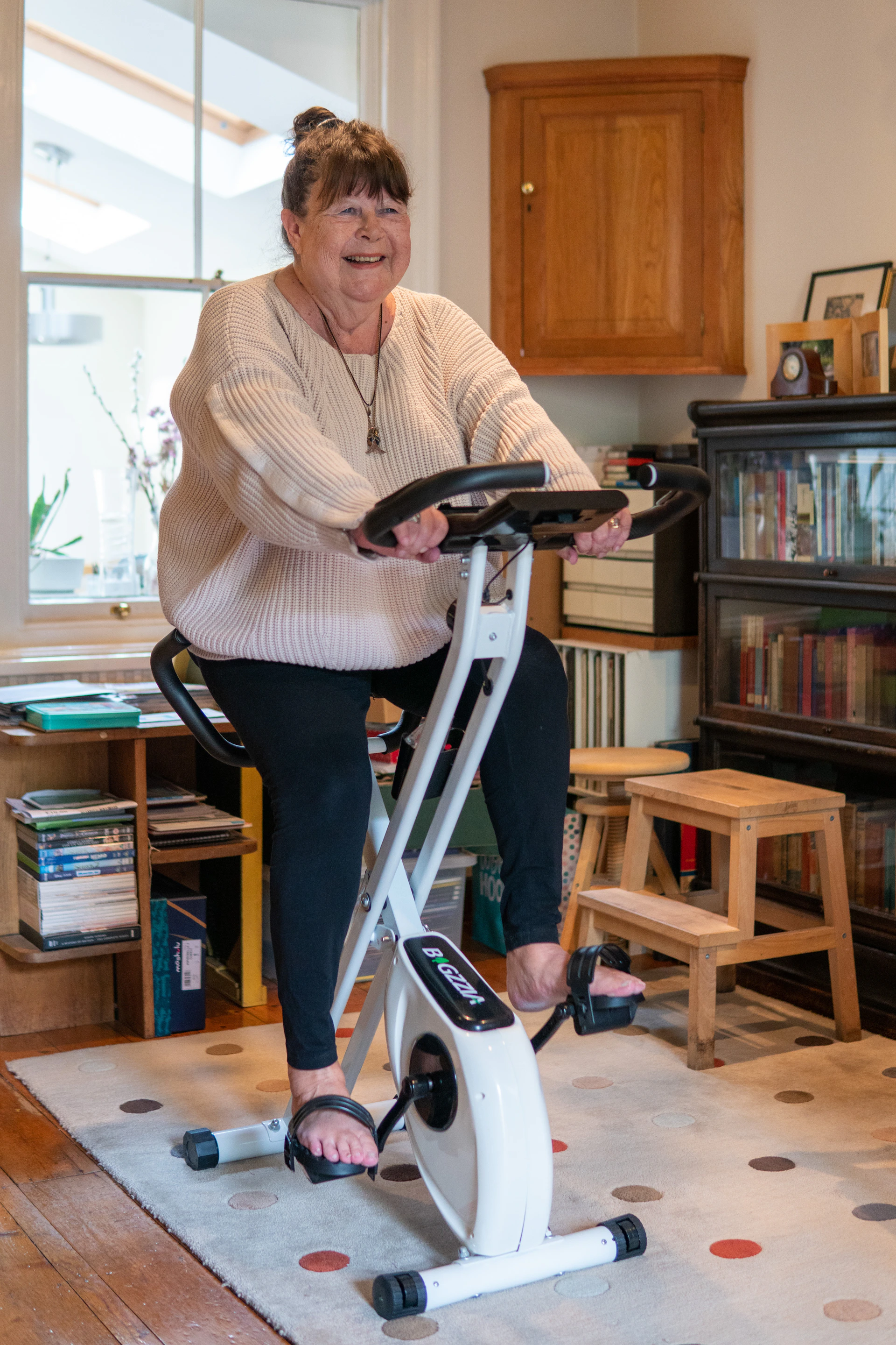 a woman standing on a scooter