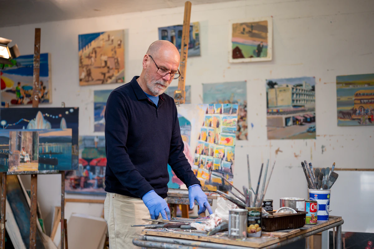 A painter at work in his studio
