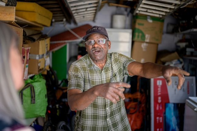 A satisfied homeowner discussing a project with a handyman.