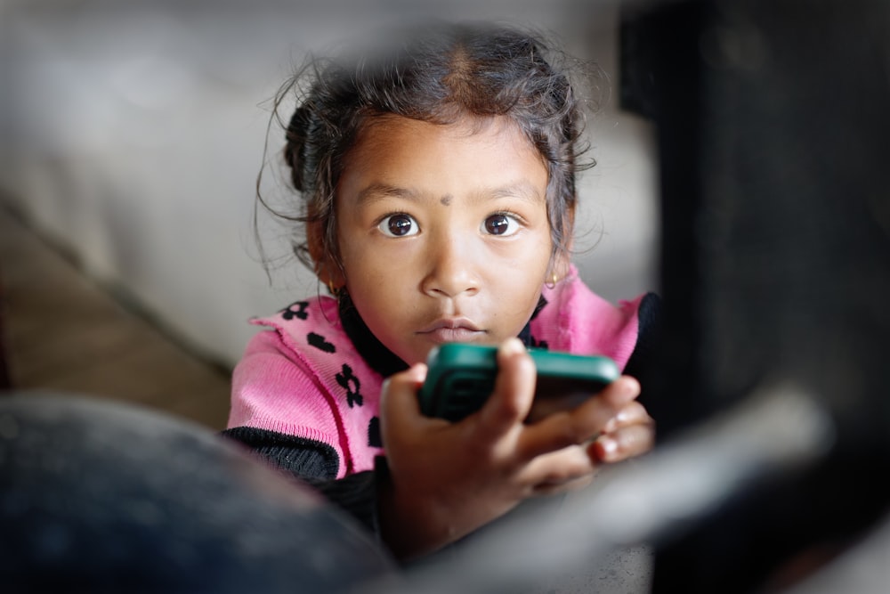 a little girl brushing her teeth