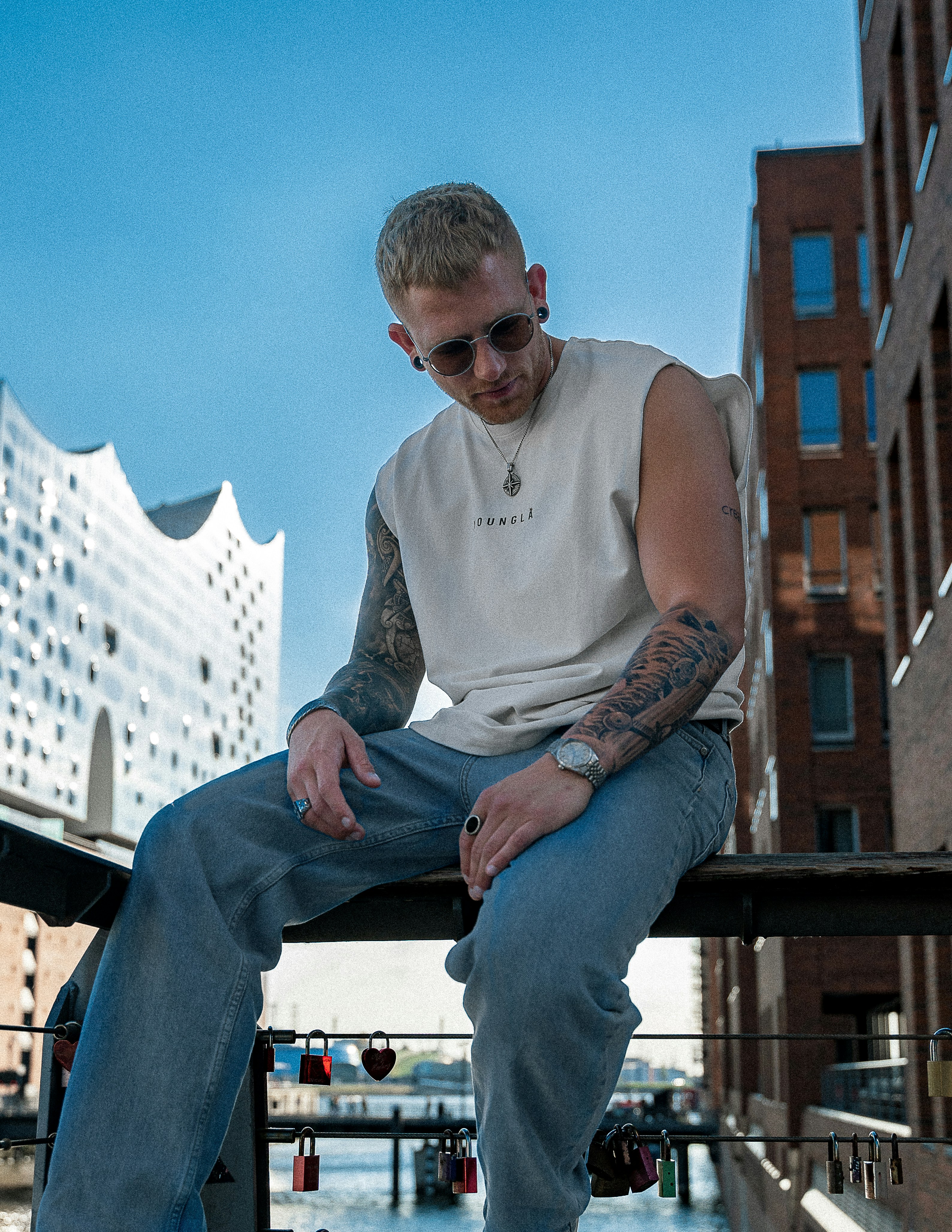 a man sitting on a railing