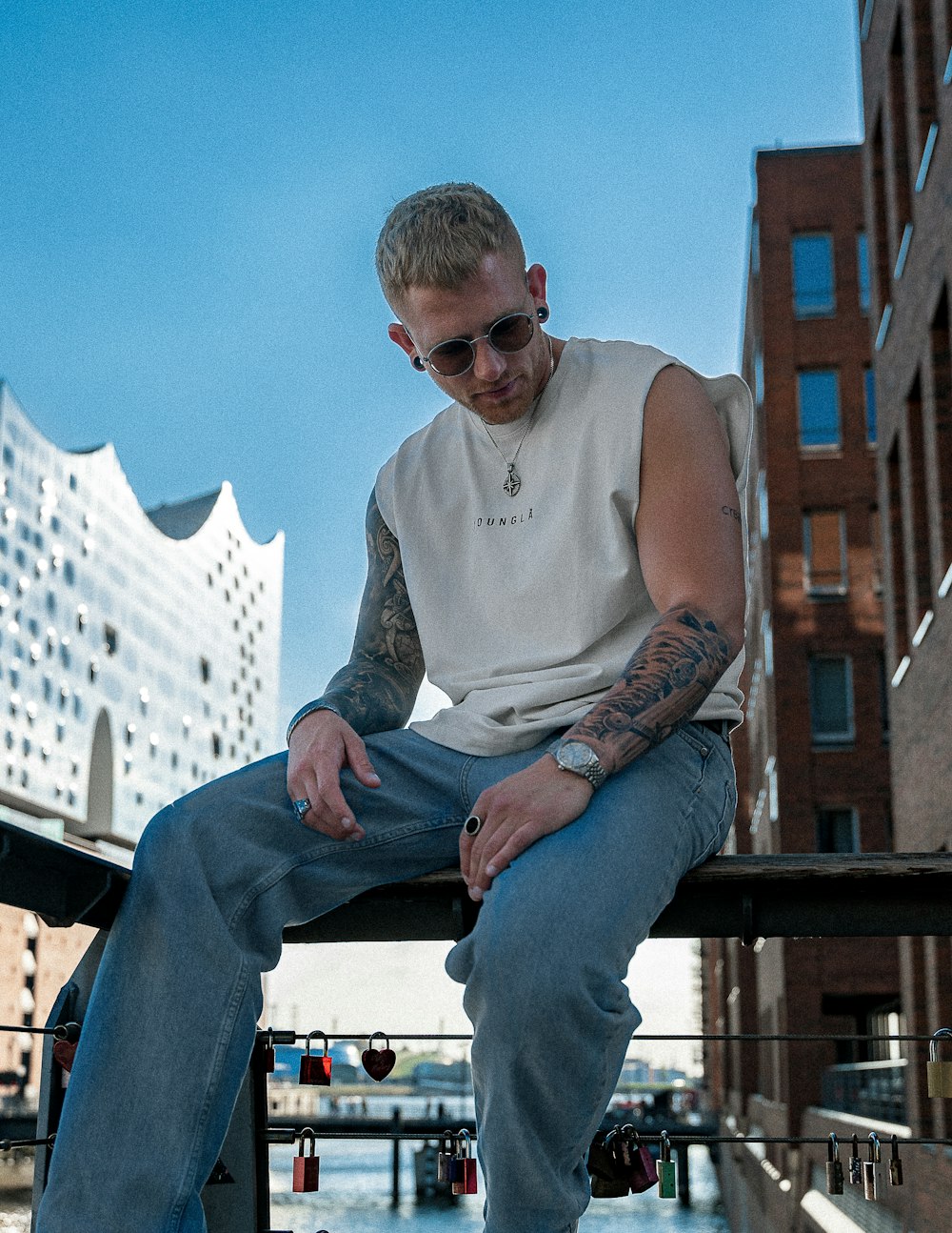 a man sitting on a railing