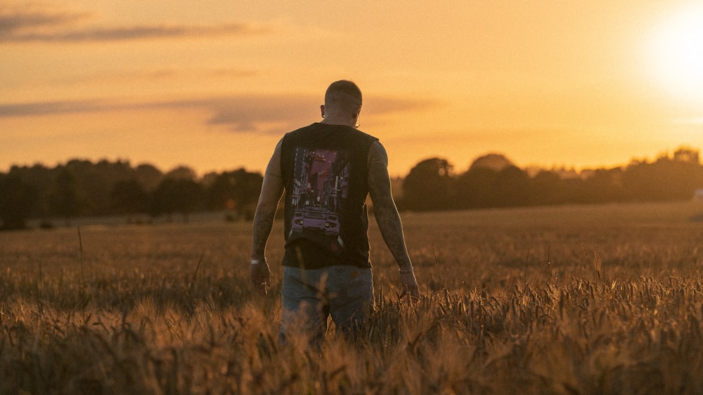 a man walking in a field