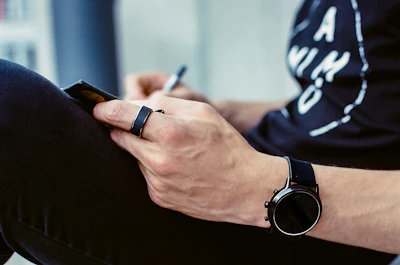 a person writing on a blackboard