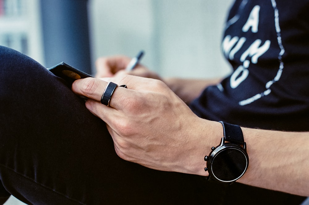 a person writing on a blackboard