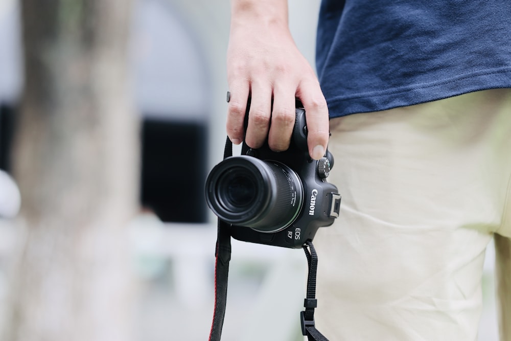 a person holding a camera