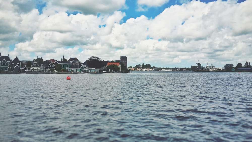 a body of water with buildings along it