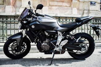 a black motorcycle parked on the street