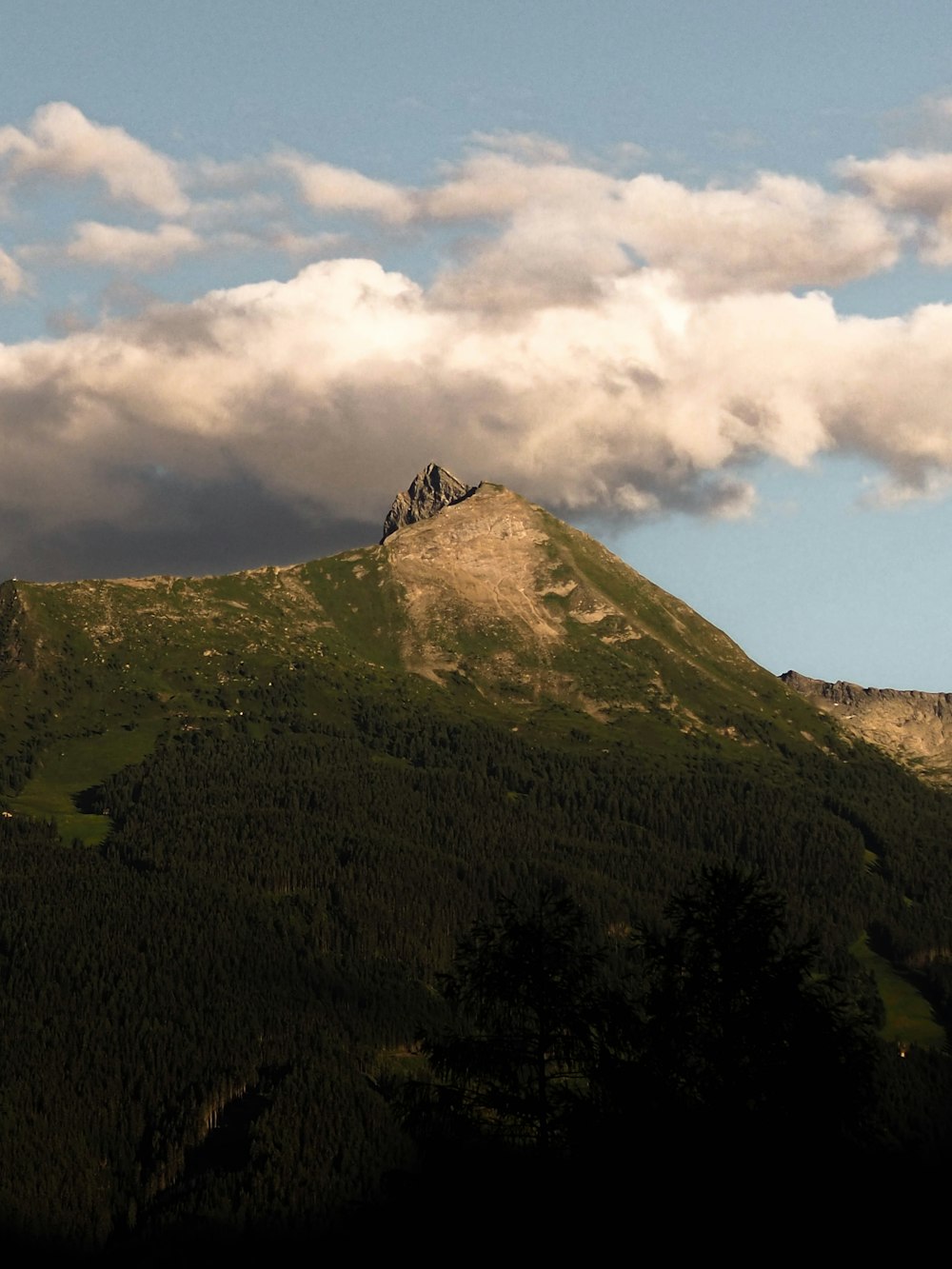 a mountain with a building on top