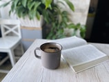 A cozy café setting with a book and a cup of coffee.