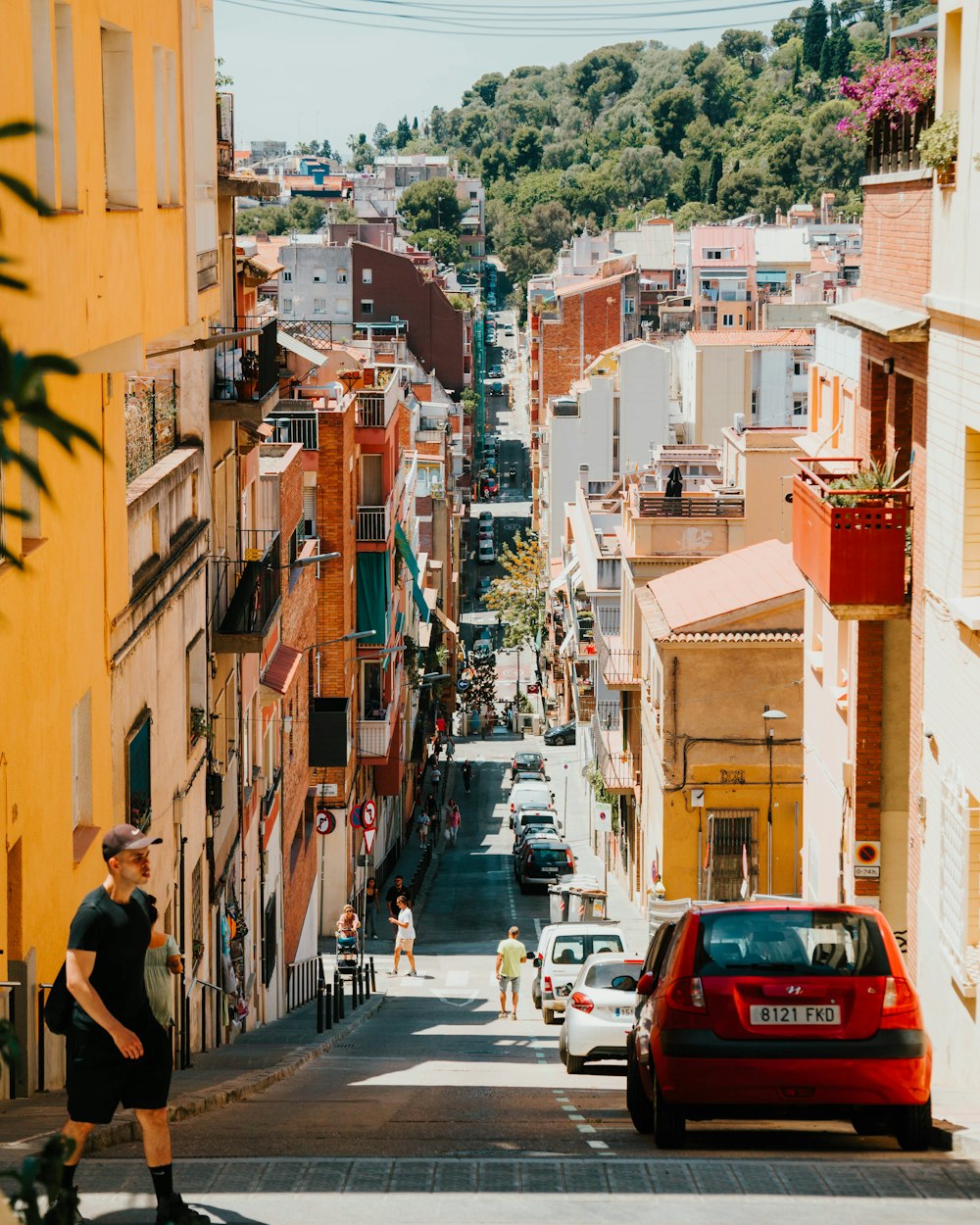 a street with cars and people on it