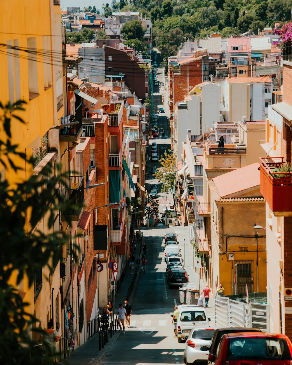 a street with cars and buildings on both sides