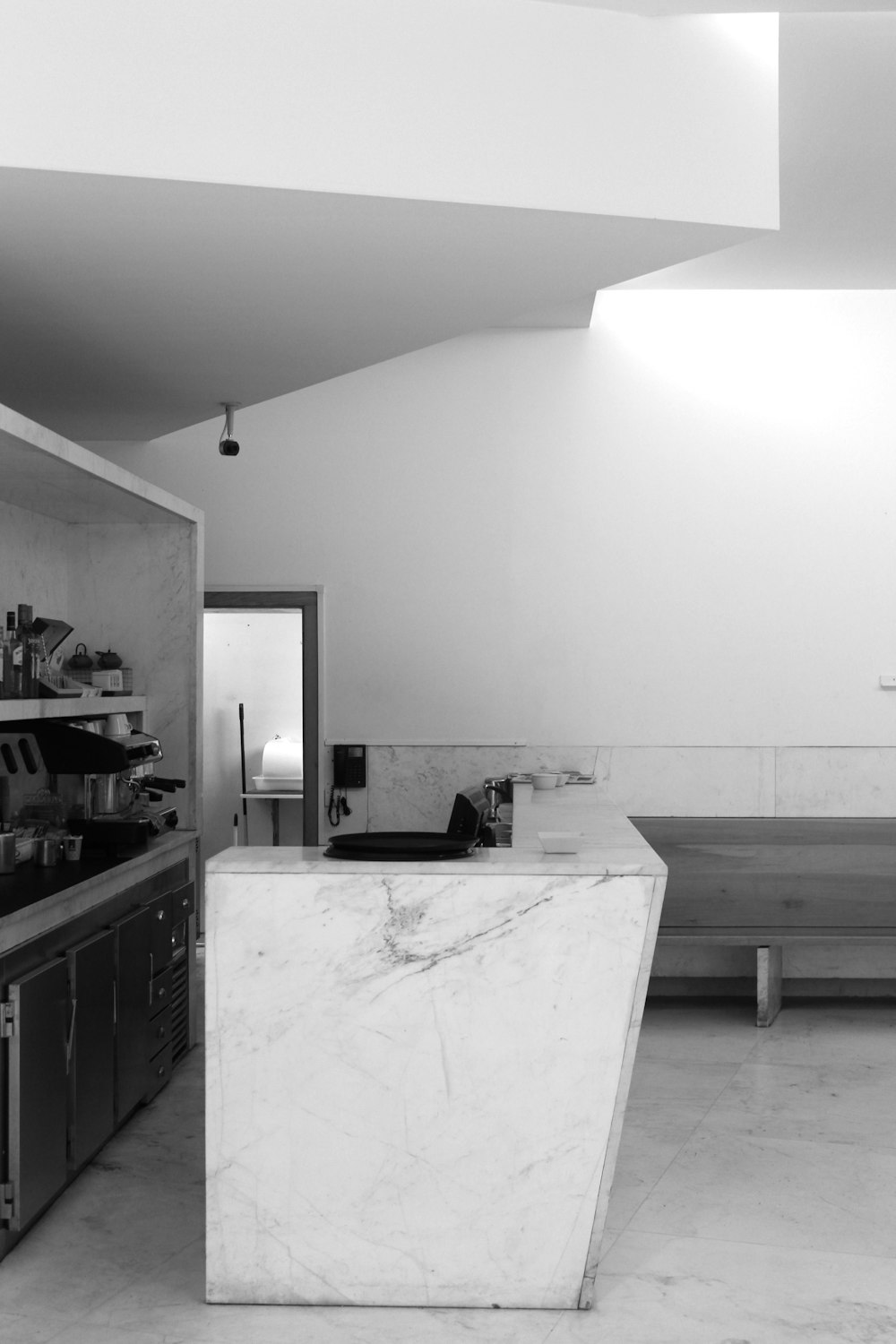 a kitchen with a large white counter
