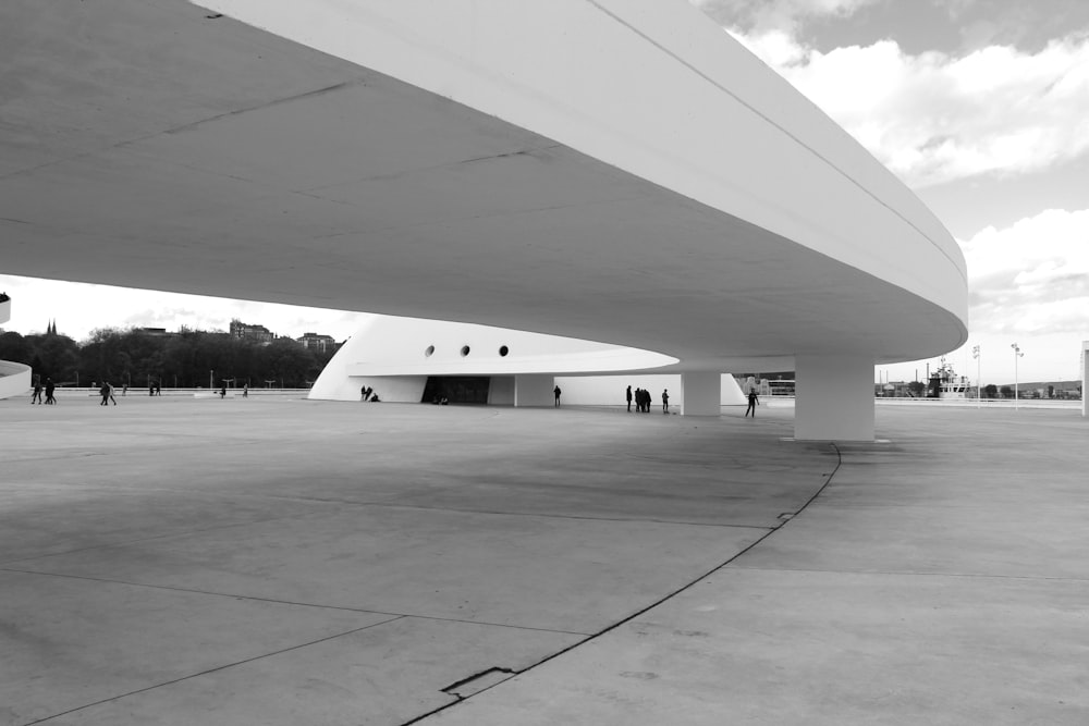 a large white building with a curved roof