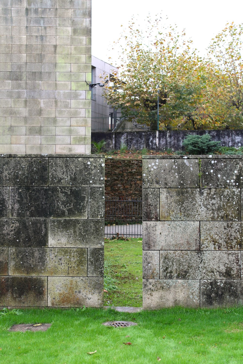 a stone wall with a stone walkway